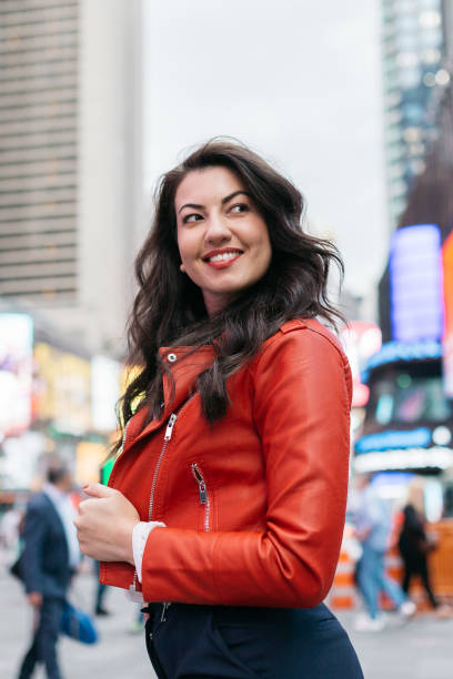istock Woman in Times Square 973333620