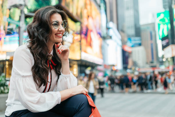 istock Woman in Times Square 973333926