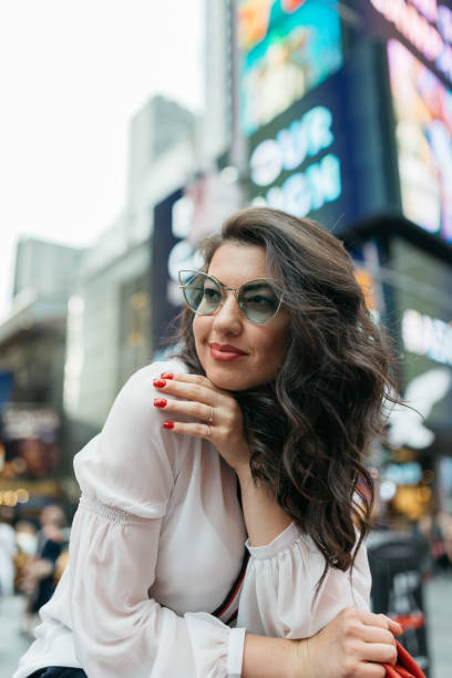 istock Woman in Times Square 973333942