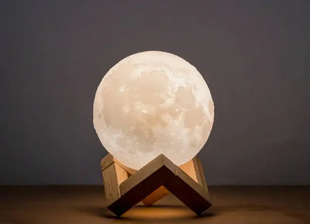 Moon bedside lamp in a wooden stand