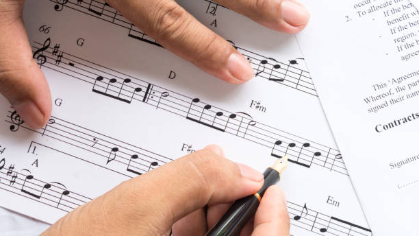 istock song composer working on music note paper 973334566