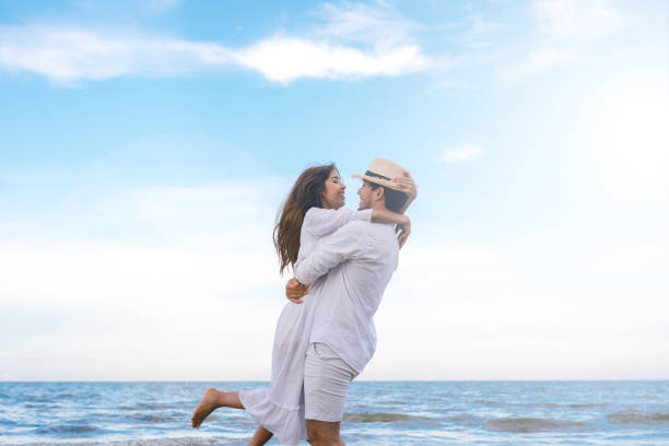 istock couple in love on beach summer vacations 973338586