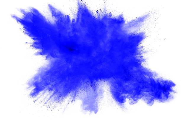 istock abstract explosion of blue dust on white background. Abstract blue powder splatter on clear  background. Freeze motion of blue powder splashing. 973338988