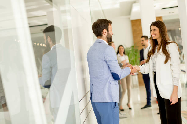 istock Handshaking in the office 973339172