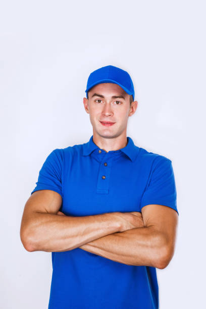 istock Delivery Concept: Portrait Young caucasian Handsome delivery man or courier 973342614
