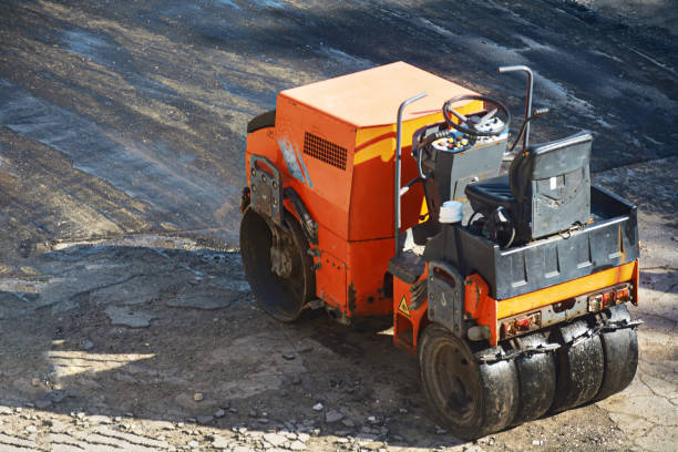 istock A small machine for laying a new asphalt. 973342920