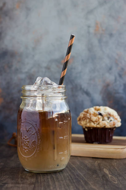 istock Iced Coffee with Baked Muffins 973343248