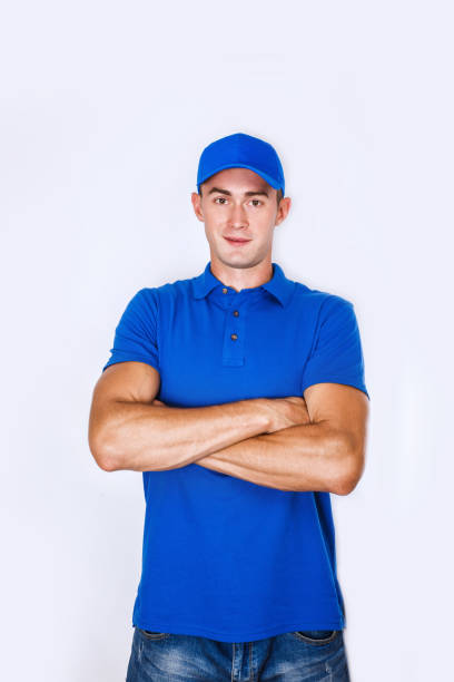 istock Delivery Concept: Portrait Young caucasian Handsome delivery man or courier 973343396