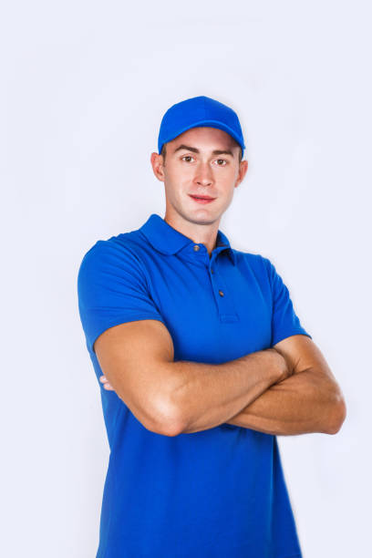 istock Delivery Concept: Portrait Young caucasian Handsome delivery man or courier 973344312