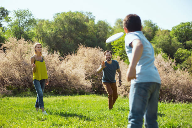 istock Loving parents playing with their son 973347232