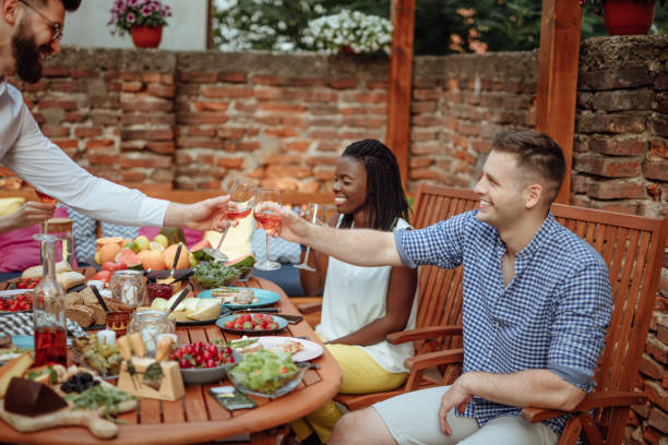 istock Friends toasting with wine 973356158
