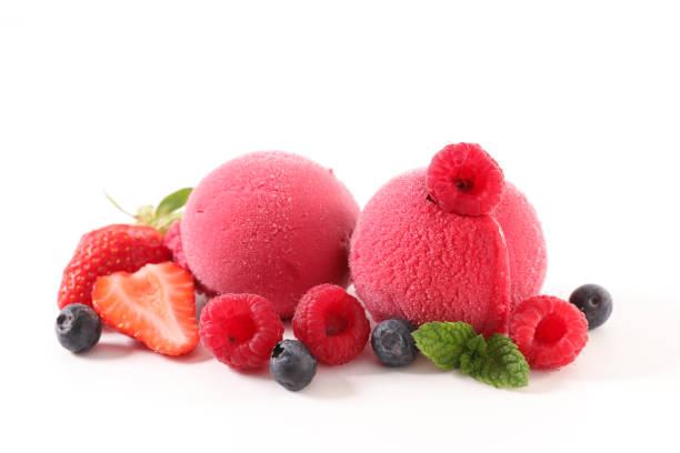 istock berry ice cream ball on white background 973356526