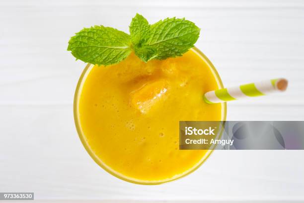 Mango Smoothies Juice And Fruit Mango Yellow On White Wood From The Top View Stock Photo - Download Image Now