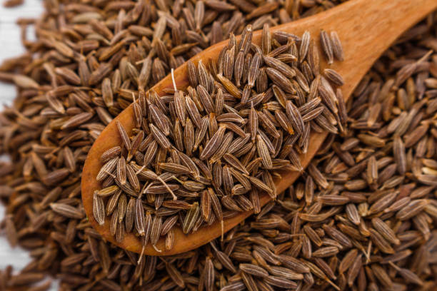 istock fragrant Zira on a wooden rustic background 973367960
