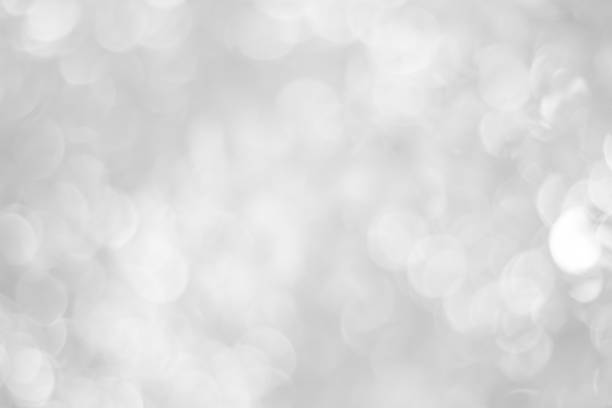 istock white blurred backdrop of nature, circle white wallpaper, gray bokeh background 973377394