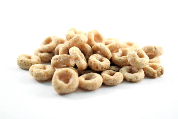 istock Whole weat circular cereal Os on white background 973378064