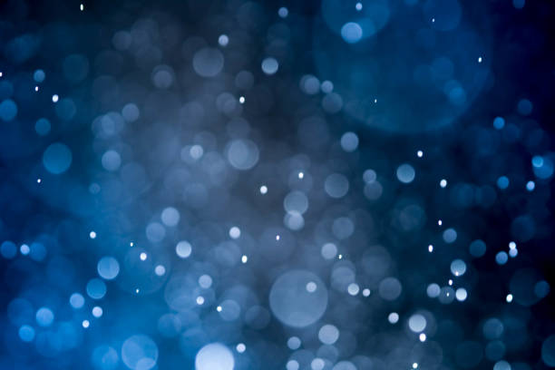 istock Christmas blur bokeh background texture abstract light glittering stars on bokeh. glitter vintage lights background 973378438