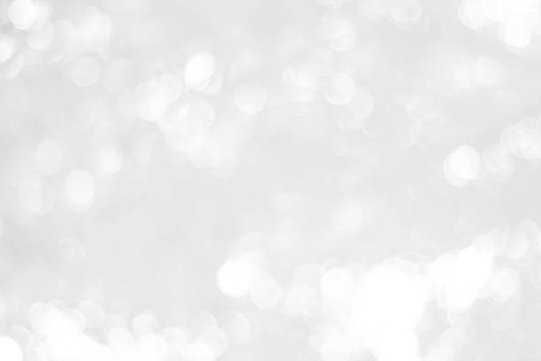 istock white blurred backdrop of nature, circle white wallpaper, gray bokeh background 973378586