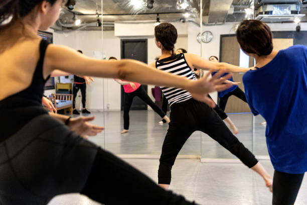 istock Group of korean women learning how to dance at class in a studio 973378628