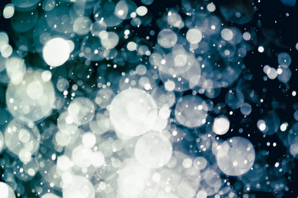 istock Christmas blur bokeh background texture abstract light glittering stars on bokeh. glitter vintage lights background 973378826