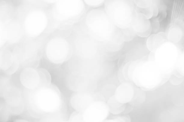istock white blurred backdrop of nature, circle white wallpaper, gray bokeh background 973378846