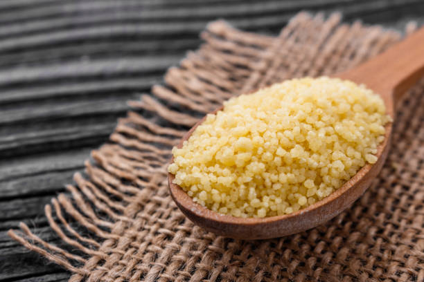 istock fresh couscous on a wooden rustic background 973381924