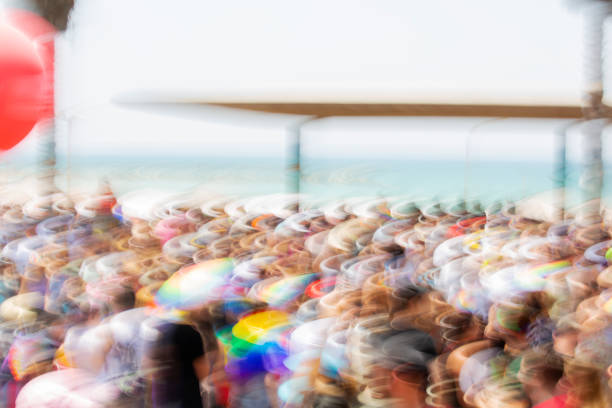 istock People on Gay Pride Parade, abstract motion blur effect. 973381988