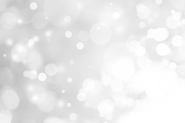istock white blurred backdrop of nature, circle white wallpaper, gray bokeh background 973381990