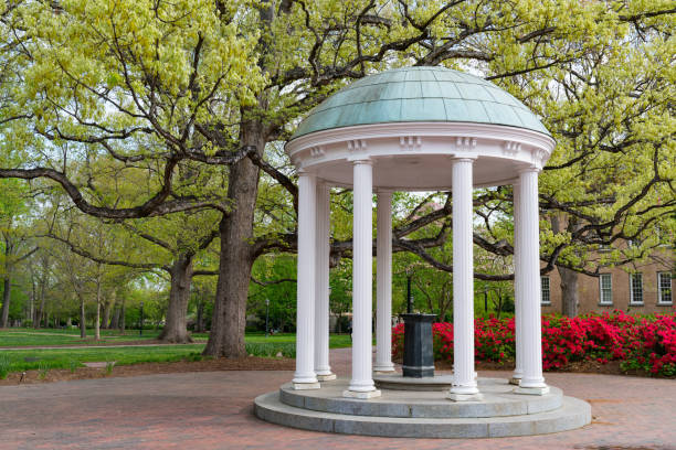 Old Well at University of North Carolina Flowers Bloom in Spring at the Old Well Rotunda at University of North Carolina in Chapel Hill university of north carolina stock pictures, royalty-free photos & images