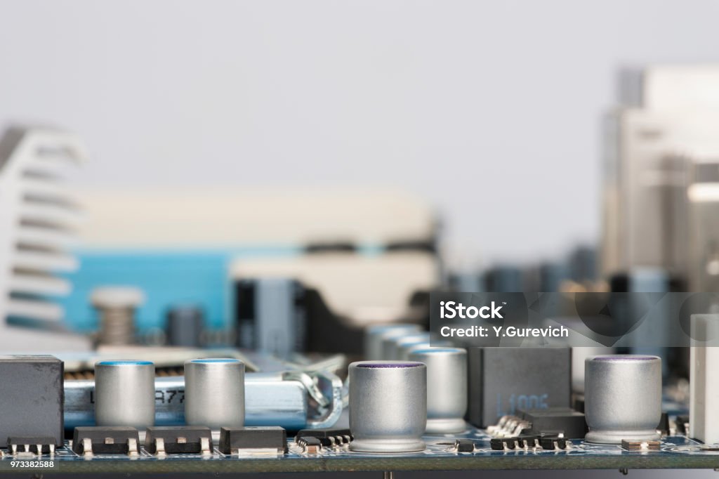 Electronic components are mounted on the device board Chips diodes capacitors chokes Close-up CPU Stock Photo