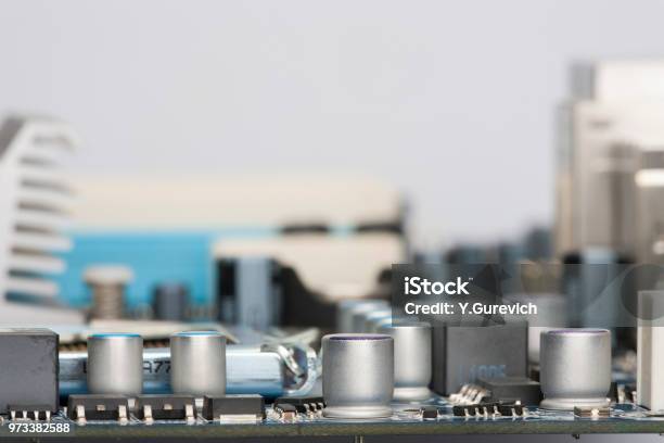 Electronic Components Are Mounted On The Device Board Chips Diodes Capacitors Chokes Closeup Stock Photo - Download Image Now