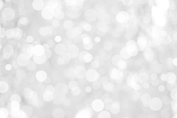 istock white blurred backdrop of nature, circle white wallpaper, gray bokeh background 973383120