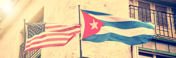 istock US and Cuban flags side by side in Havana, Cuba 973383738