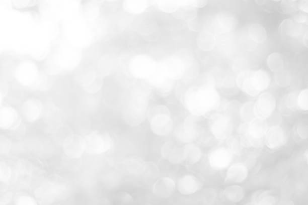 istock white blurred backdrop of nature, circle white wallpaper, gray bokeh background 973385698