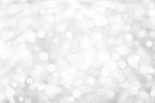 istock white blurred backdrop of nature, circle white wallpaper, gray bokeh background 973387688