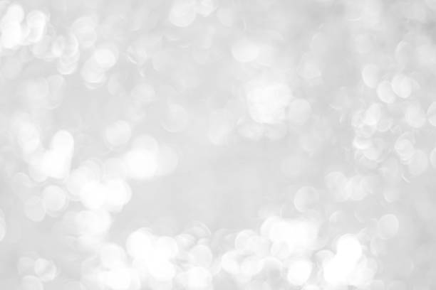 istock white blurred backdrop of nature, circle white wallpaper, gray bokeh background 973407964