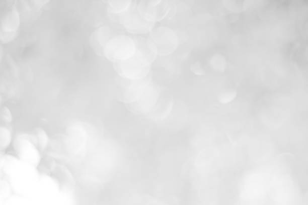 istock white blurred backdrop of nature, circle white wallpaper, gray bokeh background 973408050