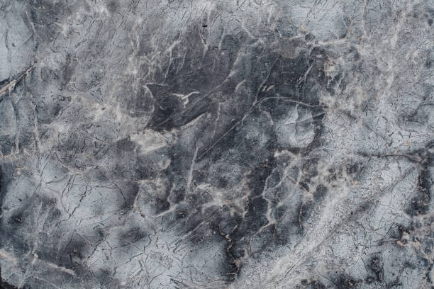 istock Fragment of stone texture with scratches and cracks. 973410874