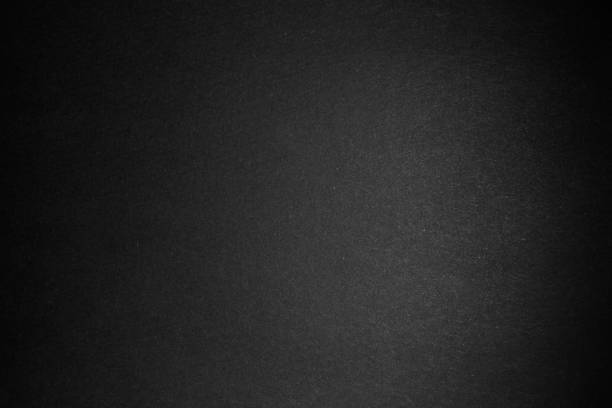 istock black paper texture or background with spotlight, dark wall backdrop wallpaper, dark tone. 973414898