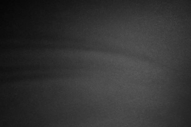 istock black paper texture or background with spotlight, dark wall backdrop wallpaper, dark tone. 973415012