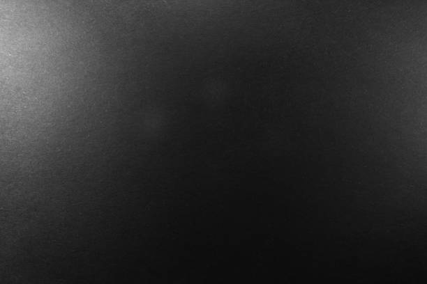 istock black paper texture or background with spotlight, dark wall backdrop wallpaper, dark tone. 973415272