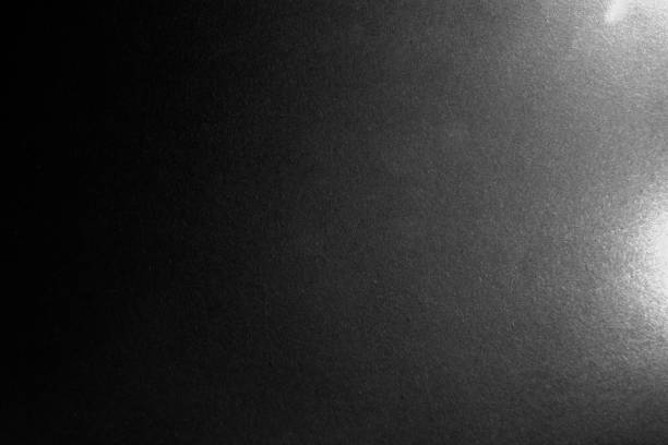 istock black paper texture or background with spotlight, dark wall backdrop wallpaper, dark tone. 973415436