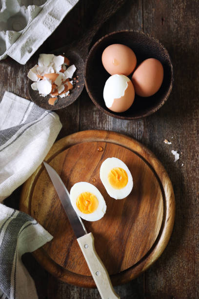 istock Chicken eggs, boiled and peeled, two halves with yolk 973416070