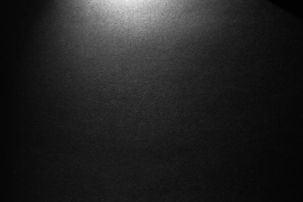 istock black paper texture or background with spotlight, dark wall backdrop wallpaper, dark tone. 973422586