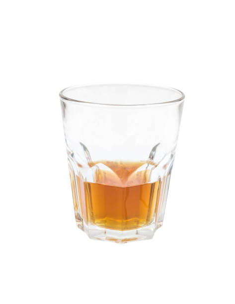 istock Glass of whiskey isolated on white background. 973427574