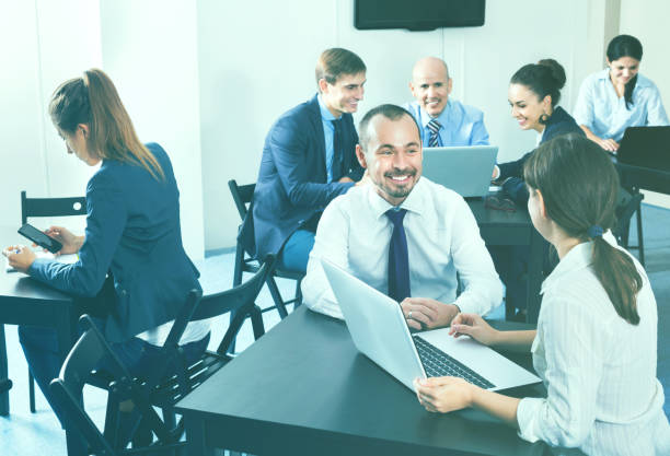 istock Coworkers working effectively on business project together 973427952
