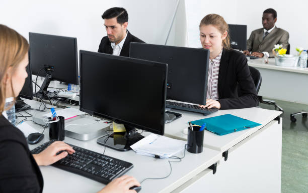 istock Group of young business people during daily work 973428066