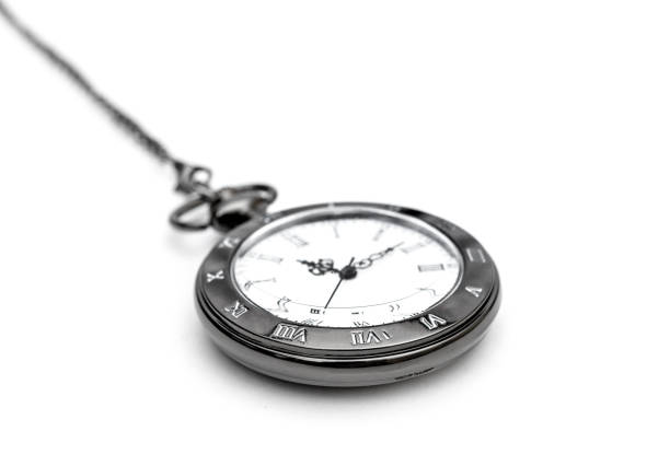 istock Pocket watch on chain on white. 973428210