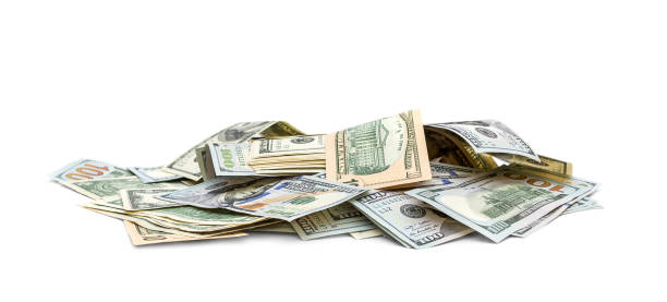 istock Heap of different dollar bills on white background. 973431500