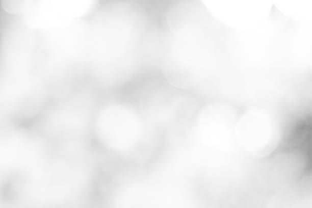 istock white blurred backdrop of nature, circle white wallpaper, gray bokeh background 973431888
